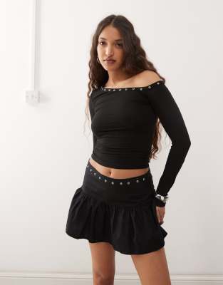 noraba one shoulder top with eyelets in black