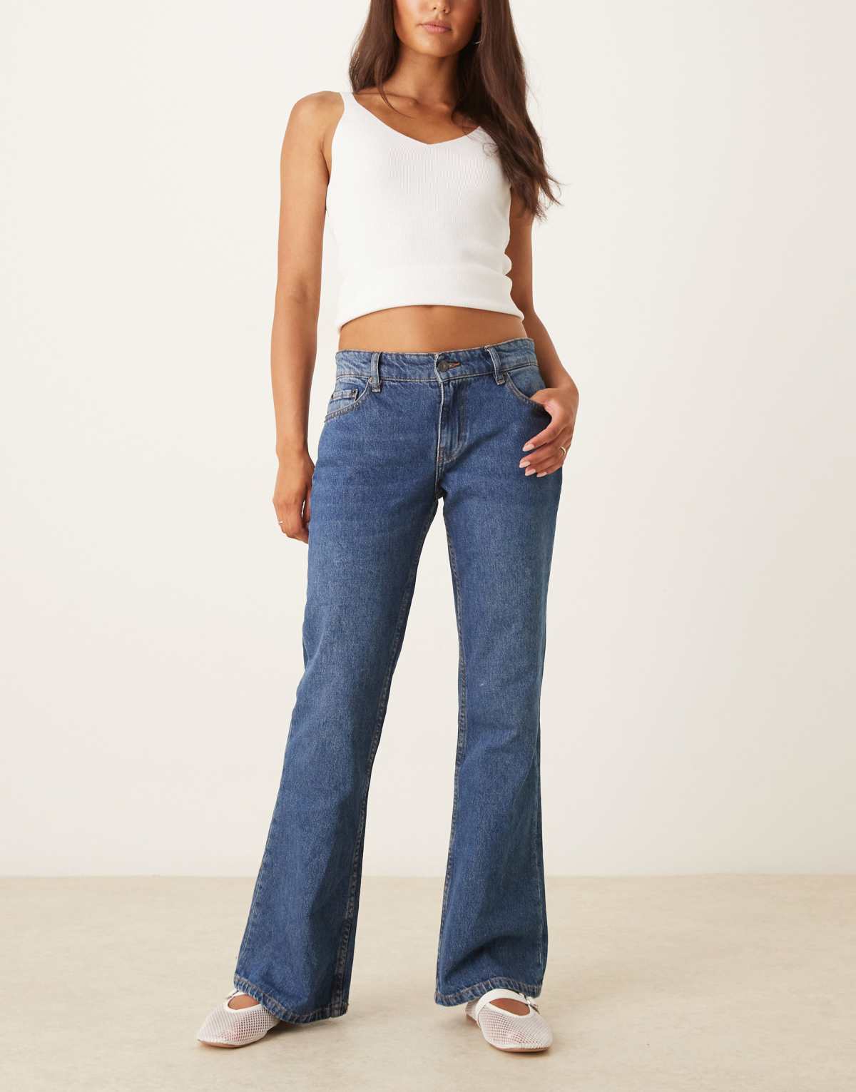 Motel rigid low rise flare jeans in mid blue used