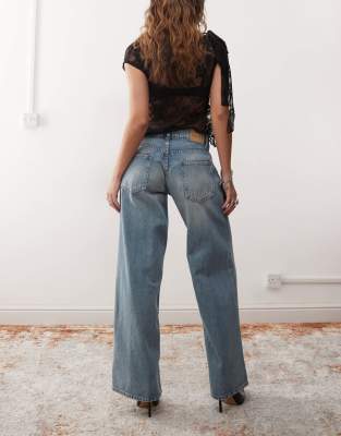 Shop Motel Roomy Extra Wide Low Rise Jeans In Blue