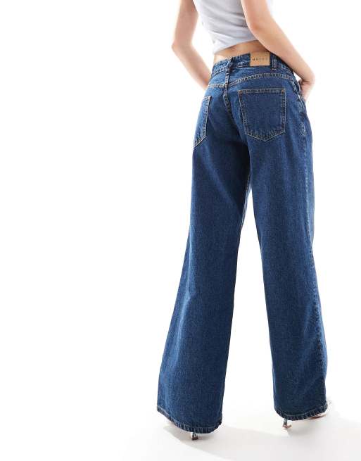 Motel roomy wide leg low rise jeans in mid indigo