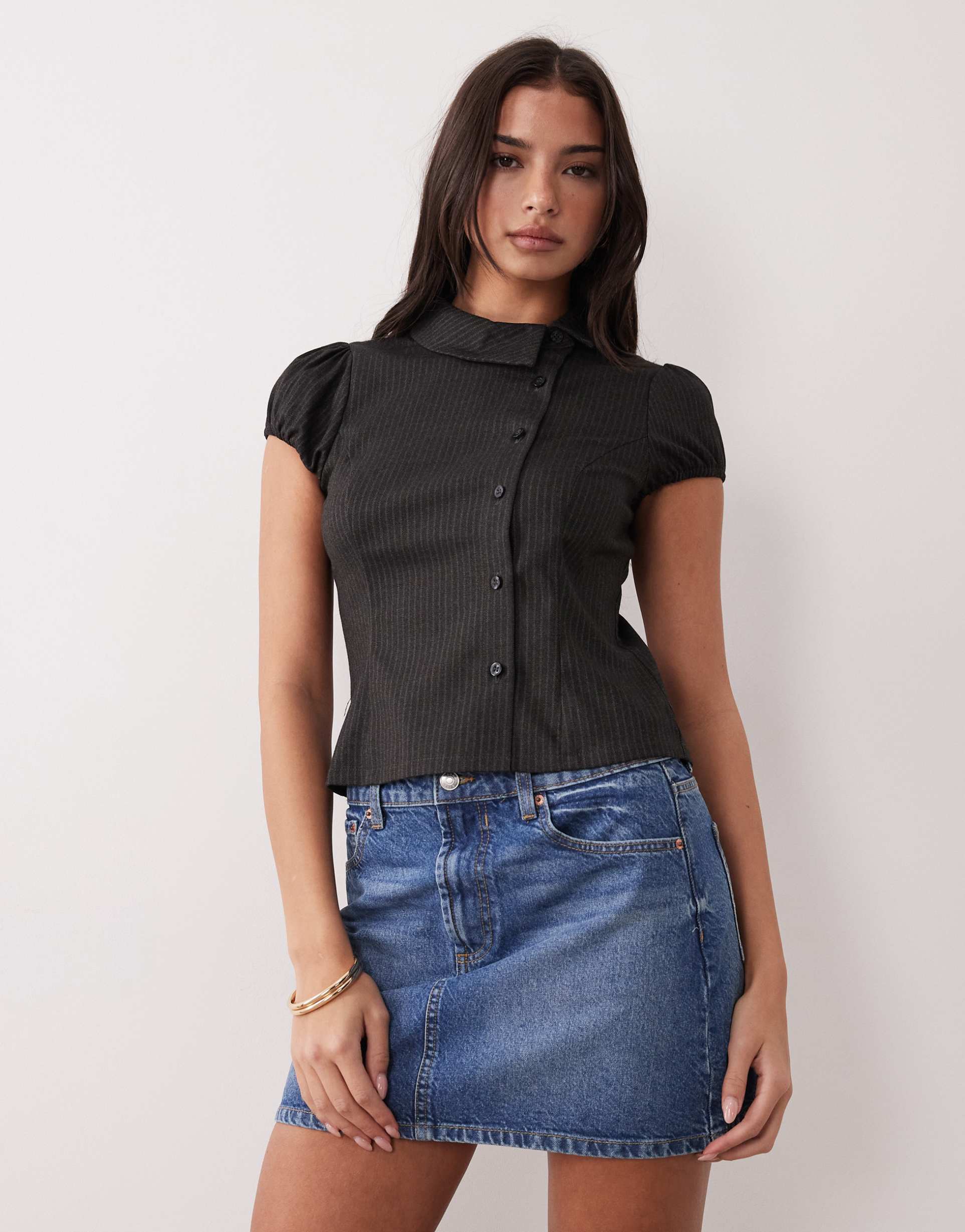 motel telese asymmetric collared shirt in black pinstripes