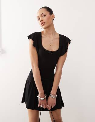 Toinette drop waist mini dress in black