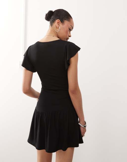 Motel Toinette drop waist mini dress in black