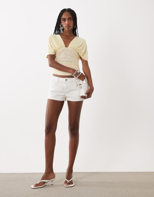 Motel Vernia plunge batwing top with lace ruchde waist in lemon | ASOS