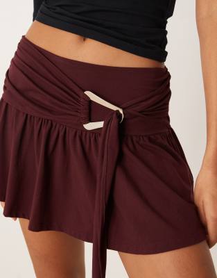 Motel Yeri Low Rise Mini Skirt With Buckle Detailing In Red