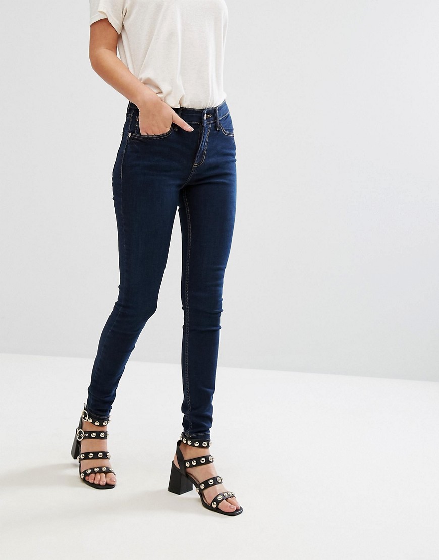 Mørkvaskede skinny jeans med mellemhøj talje fra River Island Amelie-Sort