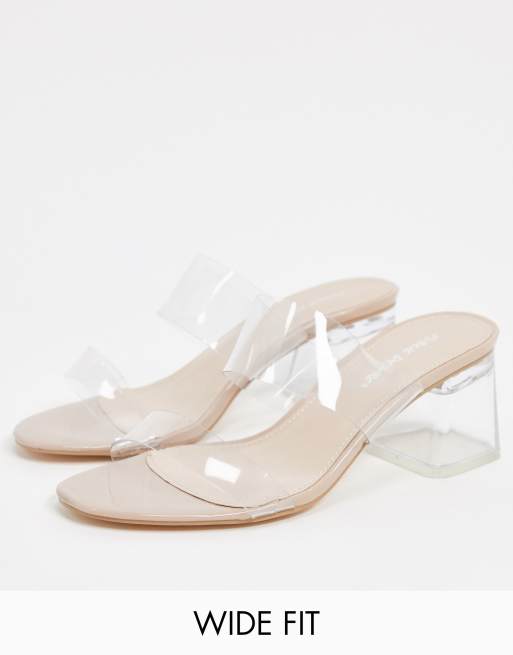 Mules de corte ancho en beis con detalles transparentes Aries de Public Desire 