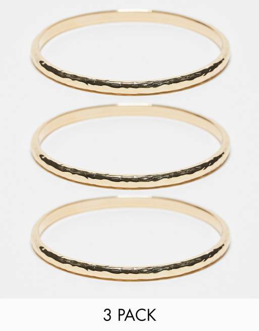 Multipack de 3 pulseras doradas rígidas texturizadas de Accessorize