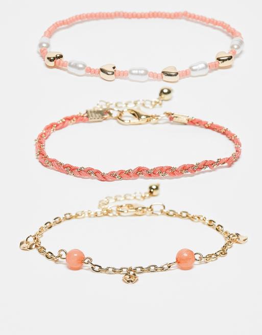 Multipacks de pulseras doradas y color coral de cuentas de ASOS DESIGN