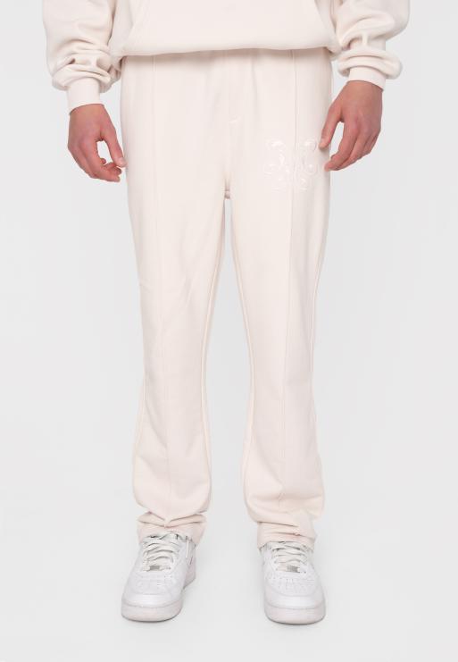 Multiply Apparel - Joggers bianco sporco con pieghe e dettaglio in rilievo