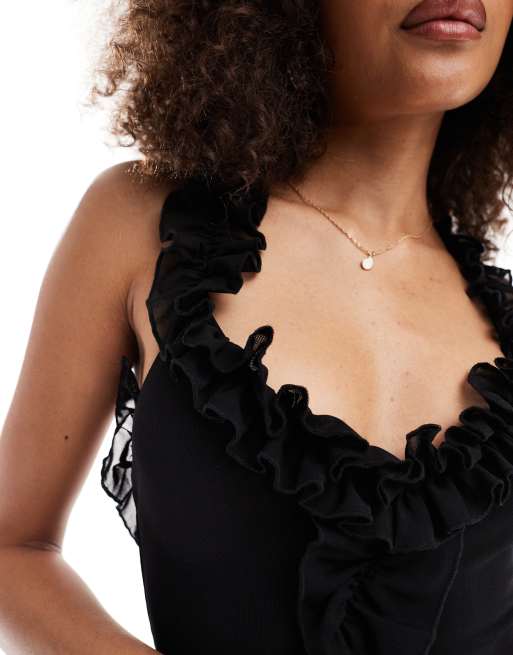 Murci – Exklusives, asymmetrisches Minikleid in Schwarz mit Rüschendetails, 2 von 4
