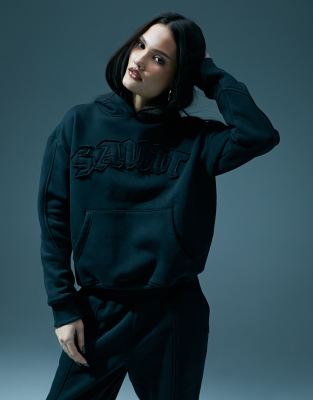 Murci - Oversize-Kapuzenpullover in verwaschenem Schwarz mit Heiligenmotiv, Kombiteil