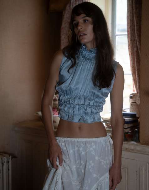 Muse Assembly ruffle high neck crop shirred top in blue crushed satin