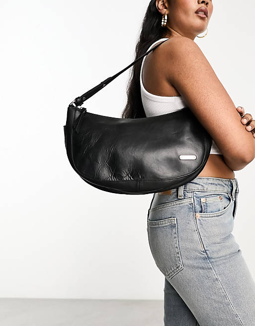 Muubaa curved leather shoulder bag in black