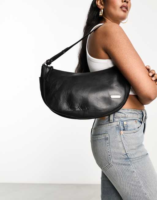 Muubaa curved leather shoulder bag in black | ASOS