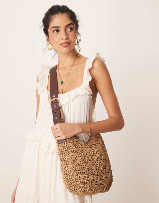 My Accessories curved raffia shoulder bag with buckle strap in beige | ASOS
