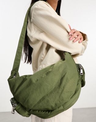 My Accessories London nylon sling bag with pockets in khaki