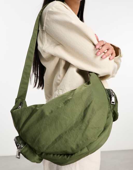 My Accessories London nylon sling bag with pockets in khaki ASOS