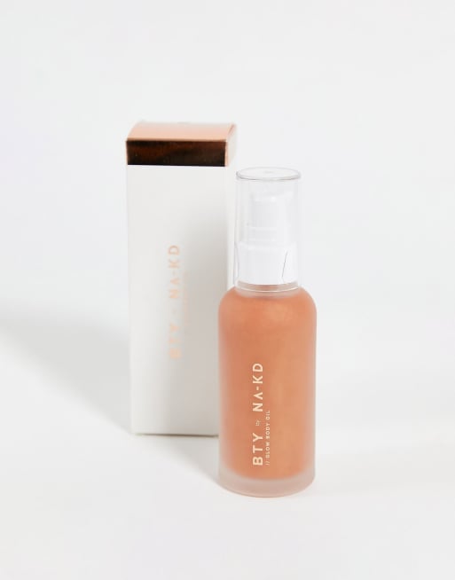 NA-KD body oil in gold