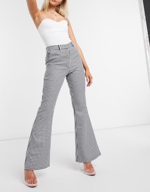 heel veel breedtegraad Mondstuk NA-KD - Flare broek met pied-de-poule in zwart | ASOS