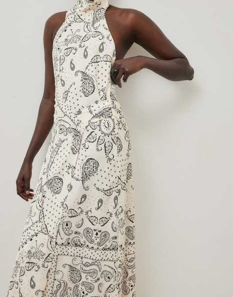 NA-KD Halterneck wrap detail maxi dress in all over print