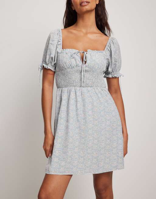 NA-KD puff sleeve bardot mini dress in blue floral print ASOS