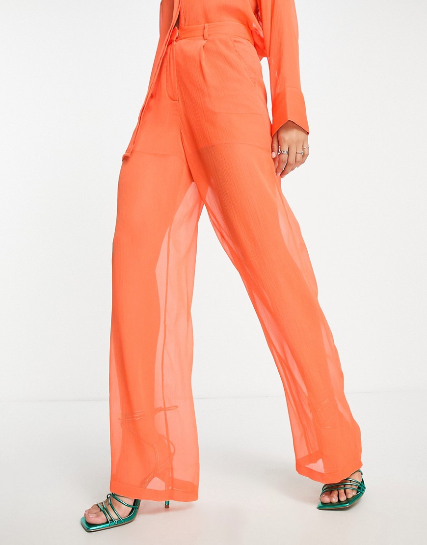 sheer wide leg pants in orange - part of a set