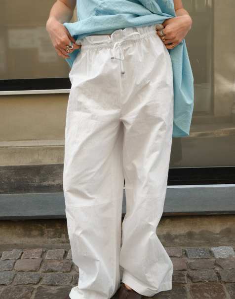 NA-KD x Charlotte Olivia Drawstring detail wide trousers in white - view 1