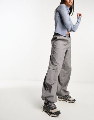 NA-KD x Chloe Schuterman loose fir cargo trousers in grey - ASOS Price Checker