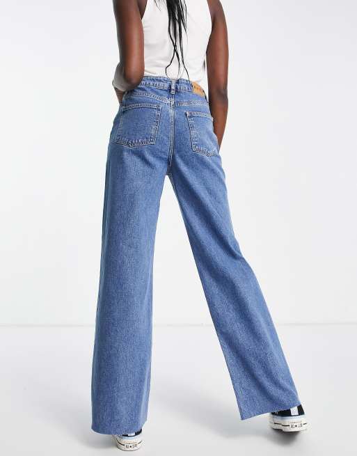 NA KD x Rianne Meijer high waist wide leg jeans in washed blue