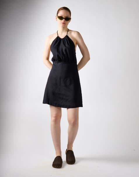 Narrated Gathered halter mini dress in black linen