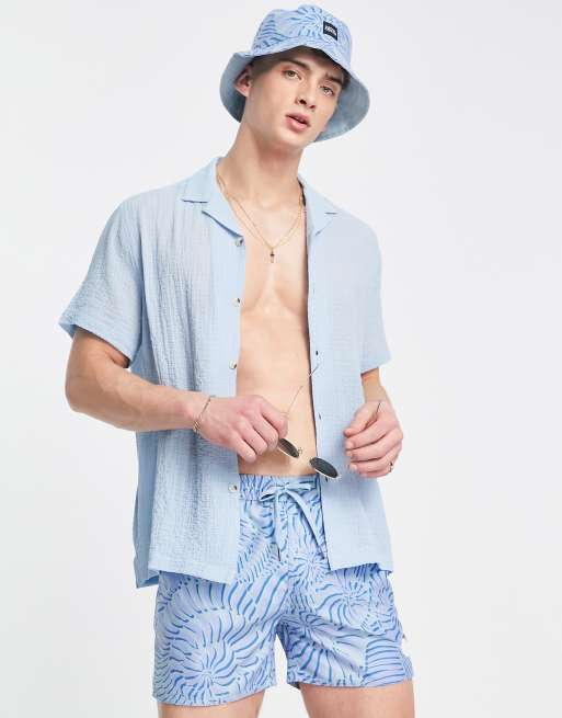 Native Youth bucket hat and swim shorts set in blue swirl print