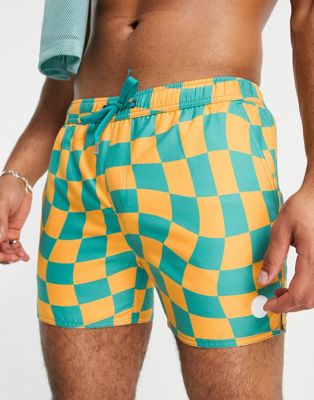 Native Youth swim shorts in blue and orange warped checkerboard