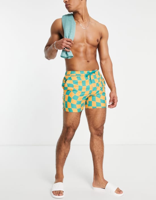 https://images.asos-media.com/products/native-youth-swim-shorts-in-blue-and-orange-warped-checkerboard/202044406-2?$n_550w$&wid=550&fit=constrain