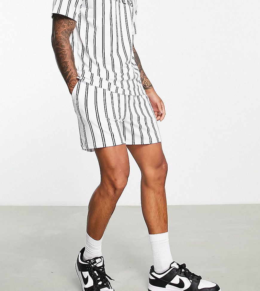 Native Youth X Football striped shorts in black and white
