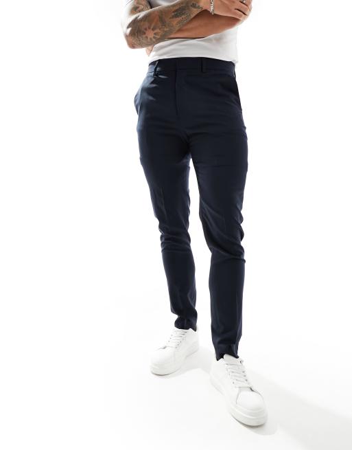 Navy-farvede habitbukser i skinny pasform fra ASOS DESIGN