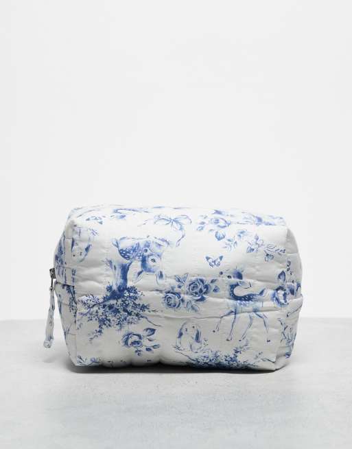 Neceser de maquillaje azul con estampado floral de Hollister