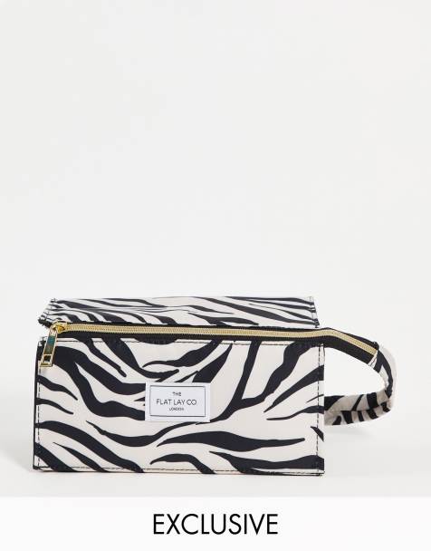 Neceser de maquillaje plano con estampado de cebra exclusivo de The Flat Lay Co. x ASOS - view 1