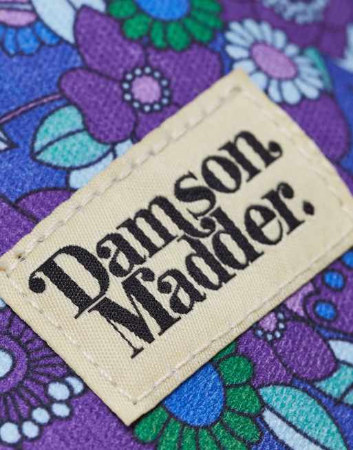 Neceser para maquillaje azul acolchado con estampado floral y logo de la marca de algodón de Damson Madder, 3 de 4