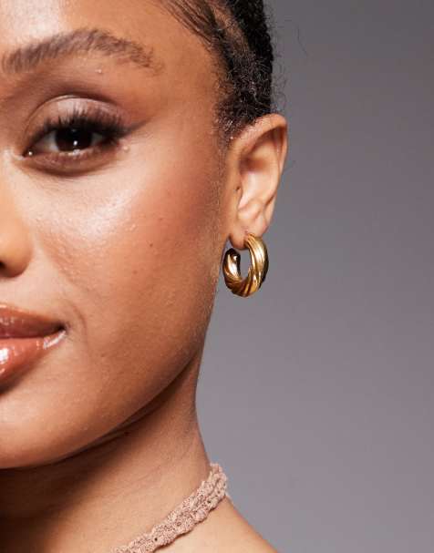 Neck On The Line 25mm chunky twist hoops in gold plated - view 1