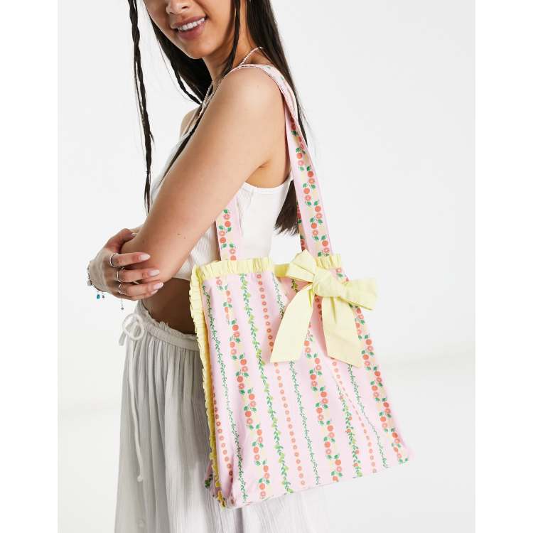 Neon Rose chintz print ruffle edge tote bag in baby pink | ASOS