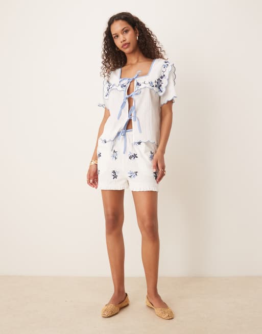 Neon Rose embroidered tie-front shorts in white and blue