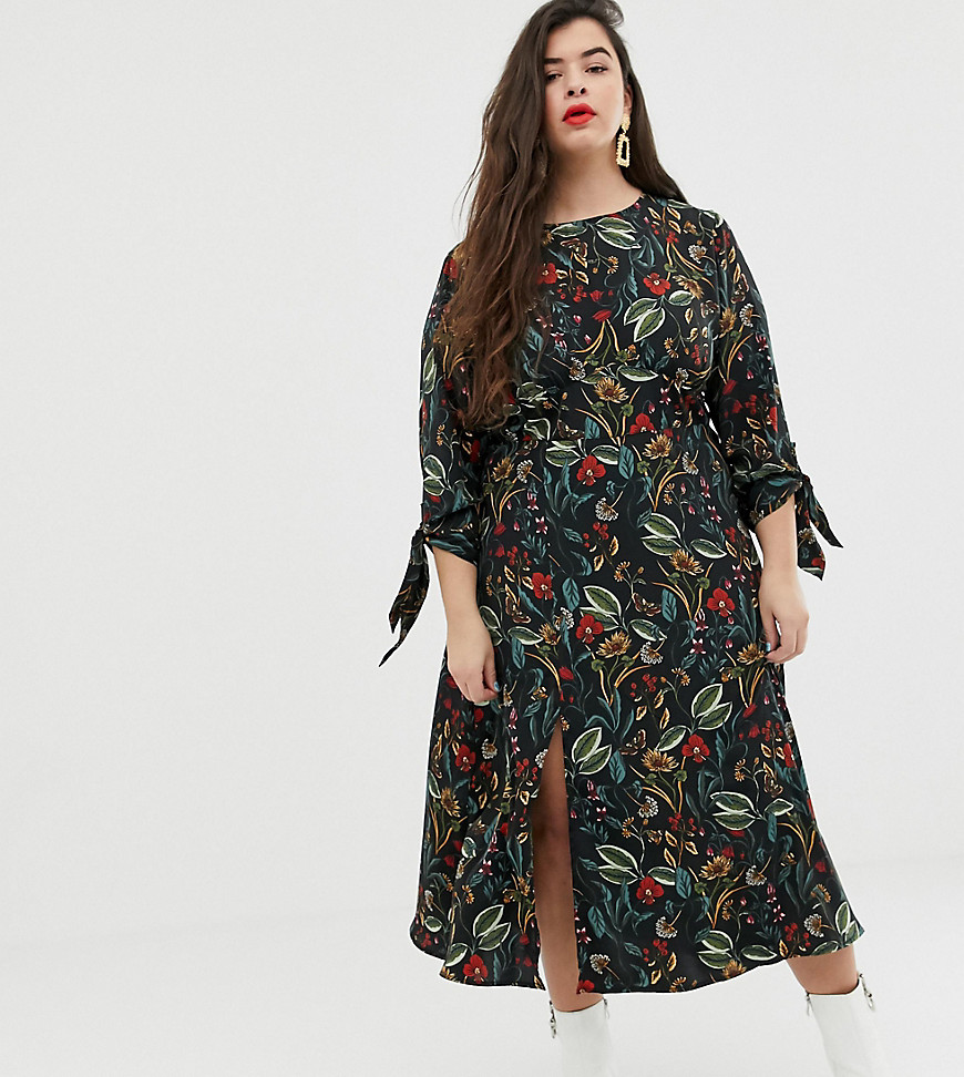 Neon Rose Plus – Blommig tea-klänning i midaximodell med knytärmar och slits i sidan-Marinblå