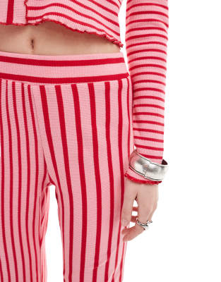 Neon Rose spliced stripe wide leg pants in red and pink