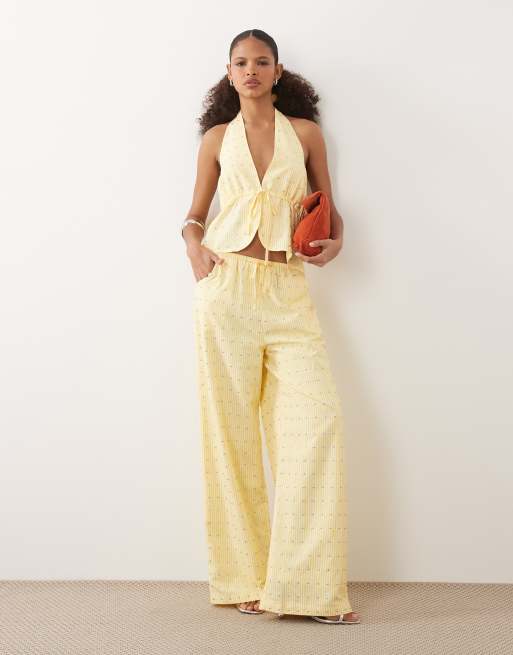 Never Fully Dressed - Ellie - Pantaloni a fondo ampio color limone a righe con coulisse e borchie in coordinato