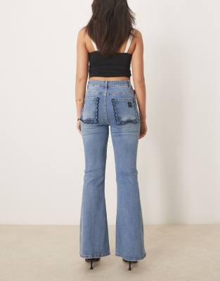 Never Fully Dressed Flared Scallop Jeans In Blue