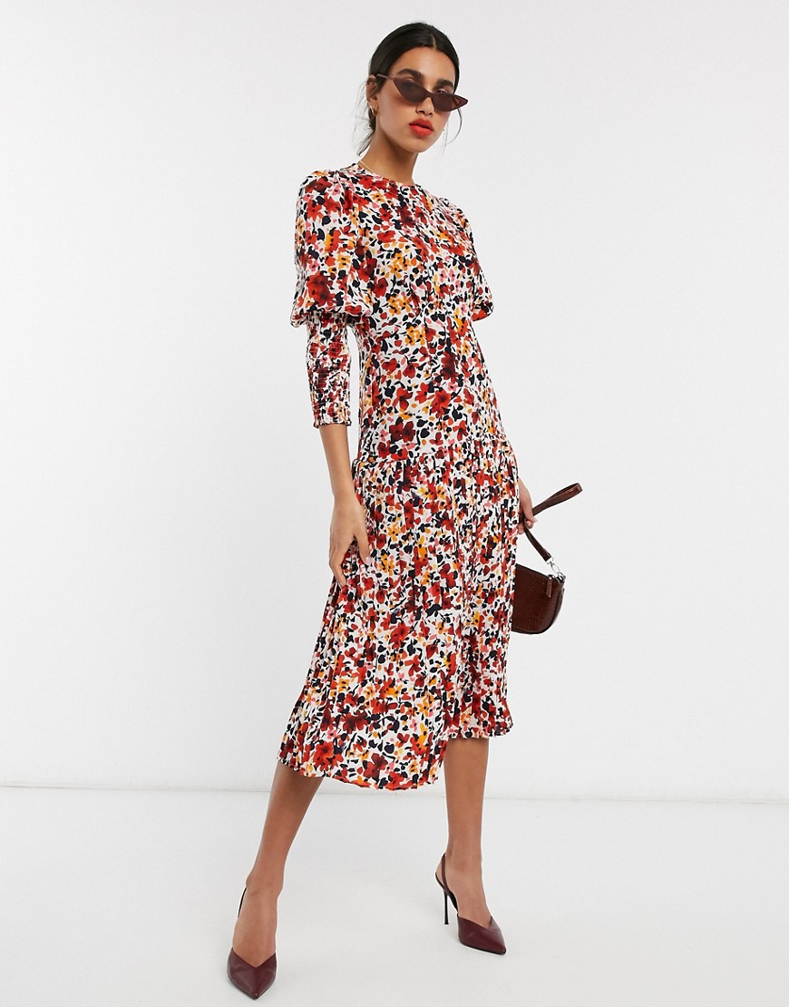 Never Fully Dressed - Lange jurk met geplooide rok, lange mouwen en oranje bloemenprint-Multi