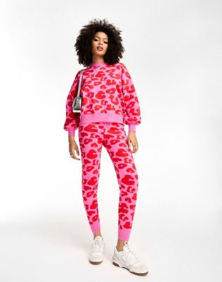 Never Fully Dressed leopard knitted jogger co-ord in pink and red