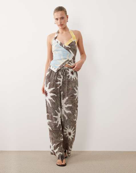 Never Fully Dressed - Pantaloni a fondo ampio con coulisse marrone con stampa di soli in coordinato - view 1