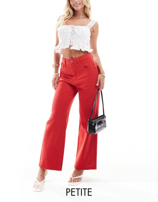 Never Fully Dressed Petite scallop pocket detail jeans in red 